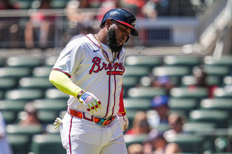 Aug 25, 2024; Cumberland, Georgia, USA; Atlanta Braves designated hitter Marcell Ozuna (20) reacts after being hit by a foul ball against the Washington Nationals during the eighth inning at Truist Park. Mandatory Credit: Dale Zanine-USA TODAY Sports