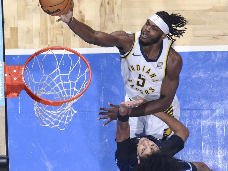 ORLANDO, FL - NOVEMBER 13: Jarace Walker #5 of the Indiana Pacers drives to the basket during the game against the Orlando Magic on November 13, 2024 at Kia Center in Orlando, Florida. NOTE TO USER: User expressly acknowledges and agrees that, by downloading and or using this photograph, User is consenting to the terms and conditions of the Getty Images License Agreement. Mandatory Copyright Notice: Copyright 2024 NBAE (Photo by Fernando Medina/NBAE via Getty Images)