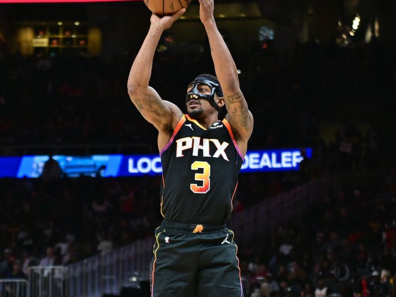 ATLANTA, GA - FEBRUARY 2: Bradley Beal #3 of the Phoenix Suns three point basket during the game against the Atlanta Hawks on February 2, 2024 at State Farm Arena in Atlanta, Georgia.  NOTE TO USER: User expressly acknowledges and agrees that, by downloading and/or using this Photograph, user is consenting to the terms and conditions of the Getty Images License Agreement. Mandatory Copyright Notice: Copyright 2024 NBAE (Photo by Adam Hagy/NBAE via Getty Images)