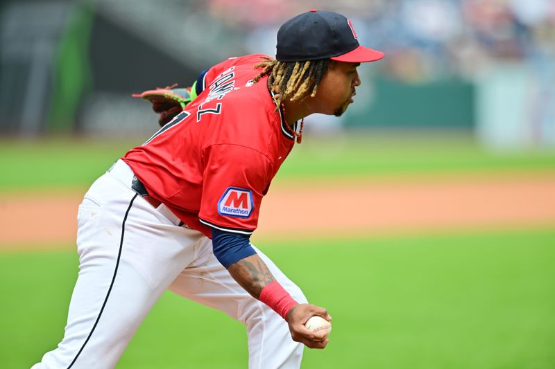 Jul 20, 2025; Cleveland, Ohio, USA; Cleveland Guardians third baseman Jose Ramirez (11) makes a bare-handed play during the seventh inning on a ball hit by Athletics second baseman Max Schuemann (not pictured) during the seventh inning at Progressive Field. Mandatory Credit: Ken Blaze-Imagn Images