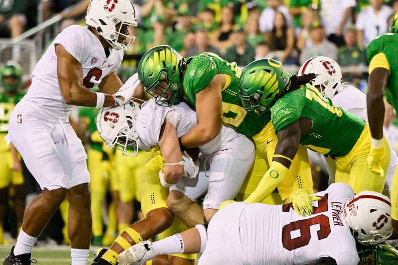 Oct 1, 2022; Eugene, Oregon, USA;  Oregon Ducks defensive lineman Treven Ma'ae (48) tackles Stanford Cardinal running back Casey Filkins (2) during the first half at Autzen Stadium. Mandatory Credit: Troy Wayrynen-USA TODAY Sports