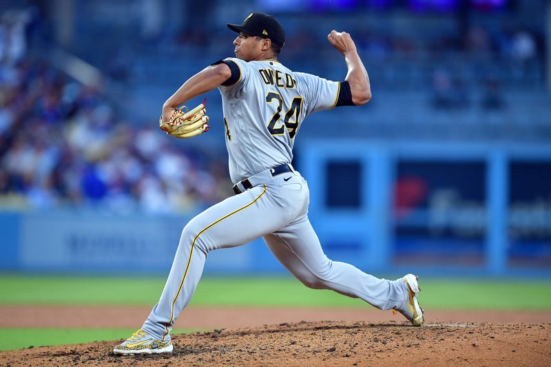 Jul 6, 2023; Los Angeles, California, USA; Pittsburgh Pirates starting pitcher Johan Oviedo (24) throws against the Los Angeles Dodgers during the fourth inning at Dodger Stadium. Mandatory Credit: Gary A. Vasquez-USA TODAY Sports