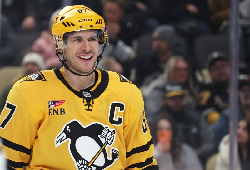 Jan 29, 2026; Pittsburgh, Pennsylvania, USA;  Pittsburgh Penguins center Sidney Crosby (87) reacts on the ice against the Chicago Blackhawks during the second period at PPG Paints Arena. Mandatory Credit: Charles LeClaire-Imagn Images