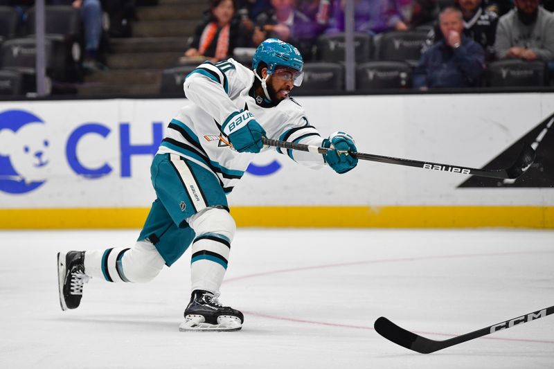 Jan 31, 2024; Anaheim, California, USA; San Jose Sharks left wing Anthony Duclair (10) shoots on goal against the Anaheim Ducks during the first period at Honda Center. Mandatory Credit: Gary A. Vasquez-USA TODAY Sports