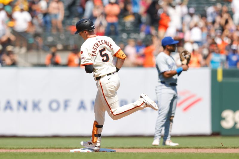 Jul 11, 2024; San Francisco, California, USA; San Francisco Giants outfielder Mike Yastrzemski (5) rounds the bases after hitting a one run home run during the ninth inning against the Toronto Blue Jays at Oracle Park. Mandatory Credit: Sergio Estrada-USA TODAY Sports