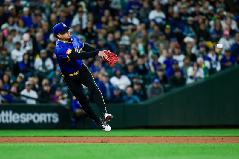 Sep 25, 2025; Seattle, Washington, USA; Seattle Mariners shortstop Leo Rivas (76) throws to second base for a forecourt against the Colorado Rockies during the seventh inning at T-Mobile Park. Mandatory Credit: Joe Nicholson-Imagn Images