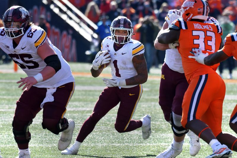 Nov 2, 2024; Champaign, Illinois, USA;  Minnesota Golden Gophers running back Darius Taylor (1) runs the through the Illinois Fighting Illini defense the during the second half at Memorial Stadium. Mandatory Credit: Ron Johnson-Imagn Images