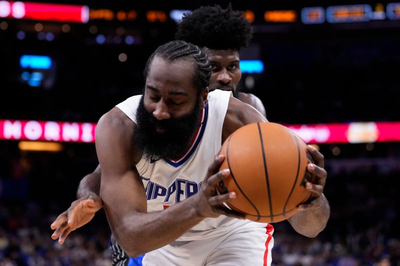 ORLANDO, FLORIDA - MARCH 29: Jonathan Isaac #1 of the Orlando Magic pressures James Harden #1 of the Los Angeles Clippers during the second quarter at Kia Center on March 29, 2024 in Orlando, Florida. NOTE TO USER: User expressly acknowledges and agrees that, by downloading and or using this photograph, User is consenting to the terms and conditions of the Getty Images License Agreement. (Photo by Rich Storry/Getty Images)