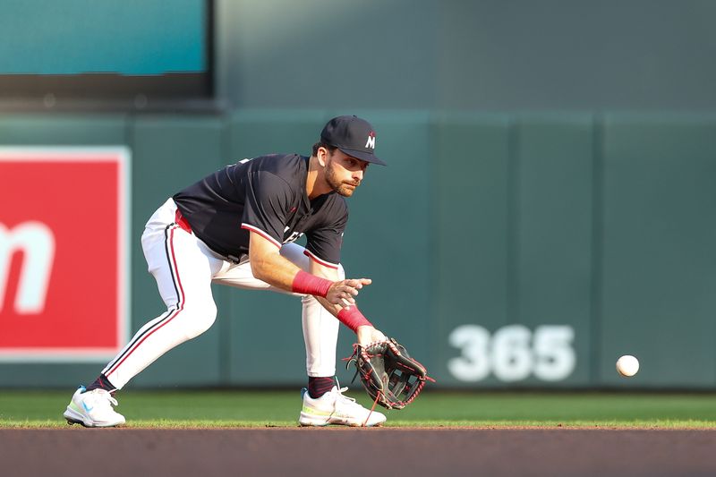 Aug 24, 2024; Minneapolis, Minnesota, USA; Minnesota Twins second baseman Edouard Julien (47) fields the ball hit by St. Louis Cardinals shortstop Masyn Winn (0) during the first inning at Target Field. Mandatory Credit: Matt Krohn-USA TODAY Sports