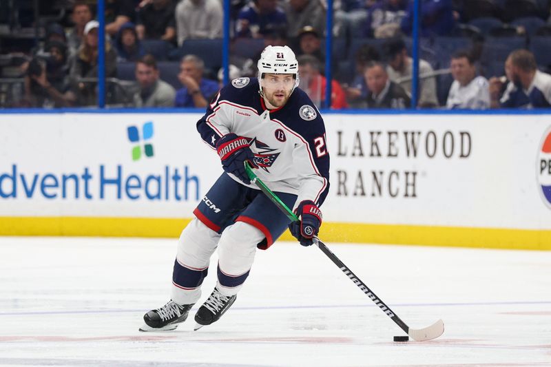 Mar 4, 2025; Tampa, Florida, USA; Columbus Blue Jackets left wing James van Riemsdyk (21) controls the puck against the Tampa Bay Lightning in the third period at Amalie Arena. Mandatory Credit: Nathan Ray Seebeck-Imagn Images