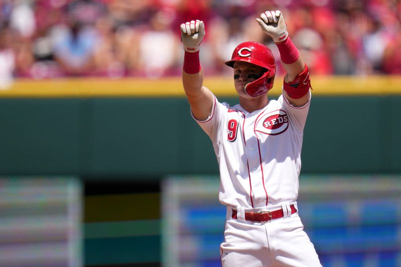 Jun 25, 2023; Cincinnati, Ohio, USA; Cincinnati Reds second baseman Matt McLain (9) gestures toward the dugout after hitting a two-run double in the fourth inning of a baseball game against the Atlanta Braves at Great American Ball Park. The Atlanta Braves won, 7-6. Mandatory Credit: Kareem Elgazzar-USA TODAY Sports