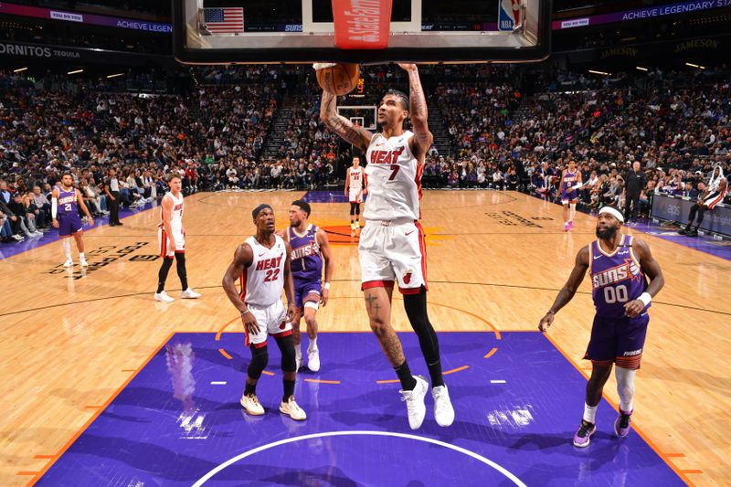 PHOENIX, AZ - NOVEMBER 6: Kel'el Ware #7 of the Miami Heat dunks the ball during the game against the Phoenix Suns on November 6, 2024 at Footprint Center in Phoenix, Arizona. NOTE TO USER: User expressly acknowledges and agrees that, by downloading and or using this photograph, user is consenting to the terms and conditions of the Getty Images License Agreement. Mandatory Copyright Notice: Copyright 2024 NBAE (Photo by Barry Gossage/NBAE via Getty Images)