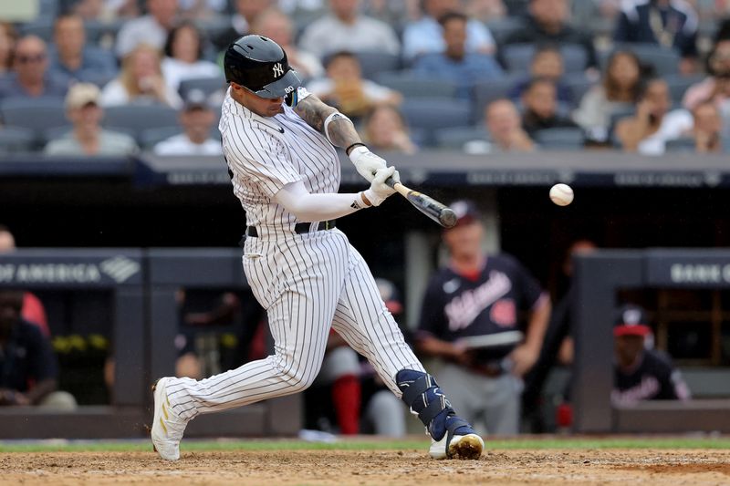 Aug 24, 2023; Bronx, New York, USA; New York Yankees left fielder Everson Pereira (80) hits a double against the Washington Nationals during the eighth inning at Yankee Stadium. The hit was his first of his major league career. Mandatory Credit: Brad Penner-USA TODAY Sports