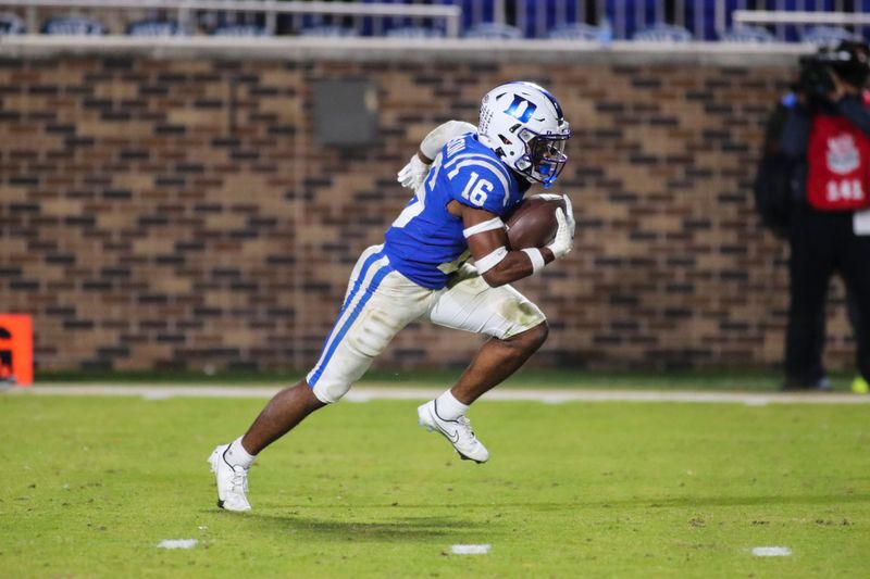 Nov 18, 2021; Durham, North Carolina, USA; Duke Blue Devils safety Jaylen Stinson (16) runs with the ball during the 2nd half of the game against the Louisville Cardinals at Wallace Wade Stadium. Mandatory Credit: Jaylynn Nash-USA TODAY Sports