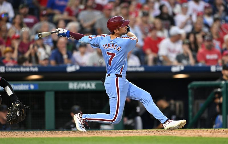 Jun 27, 2024; Philadelphia, Pennsylvania, USA; Philadelphia Phillies shortstop Trea Turner (7) hits a double against the Miami Marlins in the seventh inning at Citizens Bank Park. Mandatory Credit: Kyle Ross-USA TODAY Sports