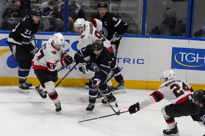 Feb 19, 2024; Tampa, Florida, USA; Tampa Bay Lightning center Anthony Cirelli (71) moves the puck against Ottawa Senator players during the third period at Amalie Arena. Mandatory Credit: Dave Nelson-USA TODAY Sports