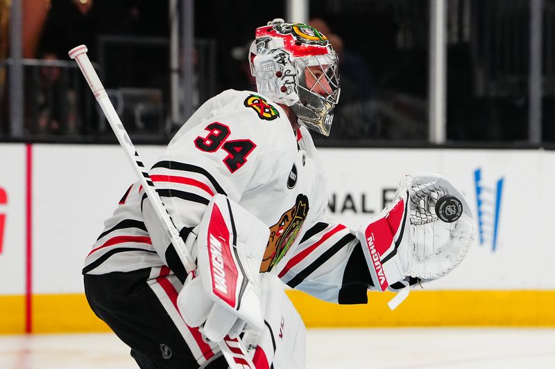 Apr 16, 2024; Las Vegas, Nevada, USA; Chicago Blackhawks goaltender Petr Mrazek (34) warms up before a game against the Vegas Golden Knights at T-Mobile Arena. Mandatory Credit: Stephen R. Sylvanie-USA TODAY Sports