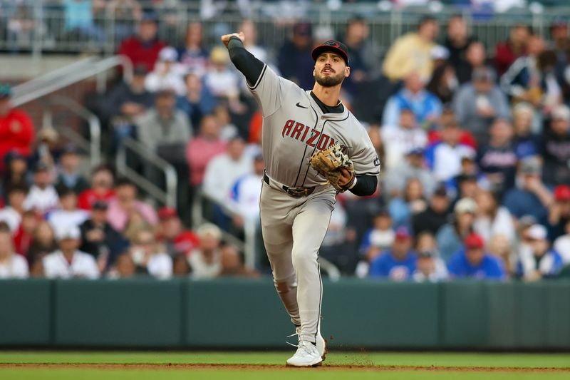 Apr 6, 2024; Atlanta, Georgia, USA; Arizona Diamondbacks shortstop Blaze Alexander (9) throws a runner out at first against the Atlanta Braves in the first inning at Truist Park. Mandatory Credit: Brett Davis-USA TODAY Sports