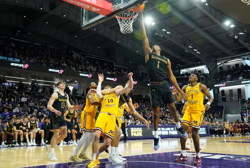 Jan 28, 2023; Evanston, Illinois, USA; Northwestern Wildcats guard Chase Audige (1) scores as on Minnesota Golden Gophers forward Joshua Ola-Joseph (1) during the second half at Welsh-Ryan Arena. Mandatory Credit: David Banks-USA TODAY Sports