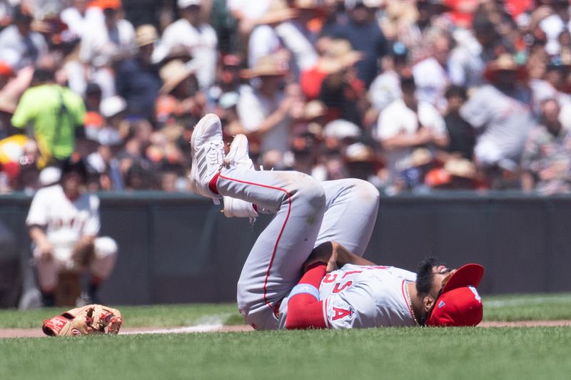 Jun 16, 2024; San Francisco, California, USA;  Los Angeles Angels third base Luis Rengifo (2) falls to the ground during the fourth inning against the San Francisco Giants at Oracle Park. Mandatory Credit: Stan Szeto-USA TODAY Sports