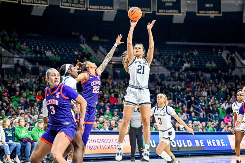 Feb 22, 2024; South Bend, Indiana, USA; Notre Dame Fighting Irish forward Maddy Westbeld (21) shoots as Clemson Tigers guard Rubi Whitehorn (22) defends in the second half at the Purcell Pavilion. Mandatory Credit: Matt Cashore-USA TODAY Sports