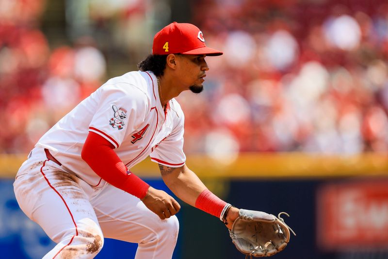 Aug 18, 2024; Cincinnati, Ohio, USA; Cincinnati Reds third baseman Santiago Espinal (4) prepares for the pitch against the Kansas City Royals in the third inning at Great American Ball Park. Mandatory Credit: Katie Stratman-USA TODAY Sports