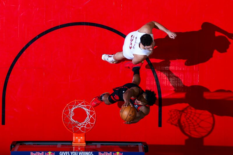 TORONTO, CANADA - FEBRUARY 10: Scottie Barnes #4 of the Toronto Raptors drives to the basket during the game against the Cleveland Cavaliers on February 10, 2024 at the Scotiabank Arena in Toronto, Ontario, Canada.  NOTE TO USER: User expressly acknowledges and agrees that, by downloading and or using this Photograph, user is consenting to the terms and conditions of the Getty Images License Agreement.  Mandatory Copyright Notice: Copyright 2024 NBAE (Photo by Vaughn Ridley/NBAE via Getty Images)