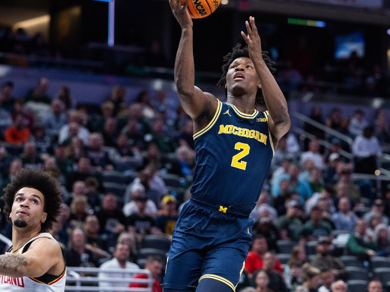 Mar 15, 2025; Indianapolis, IN, USA; Michigan Wolverines guard L.J. Cason (2) shoots the ball whileMaryland Terrapins guard Ja'Kobi Gillespie (0)  defends in the first half at Gainbridge Fieldhouse. Mandatory Credit: Trevor Ruszkowski-Imagn Images