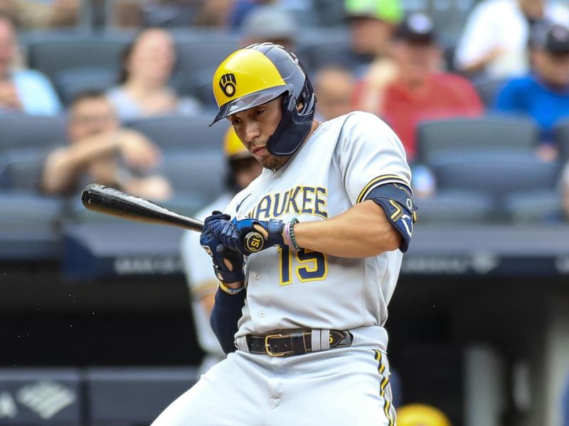 Sep 10, 2023; Bronx, New York, USA;  Milwaukee Brewers left fielder Tyrone Taylor (15 ) leans back top avoid getting hit by a pitch in the fifth inning against the New York Yankees at Yankee Stadium. Mandatory Credit: Wendell Cruz-USA TODAY Sports