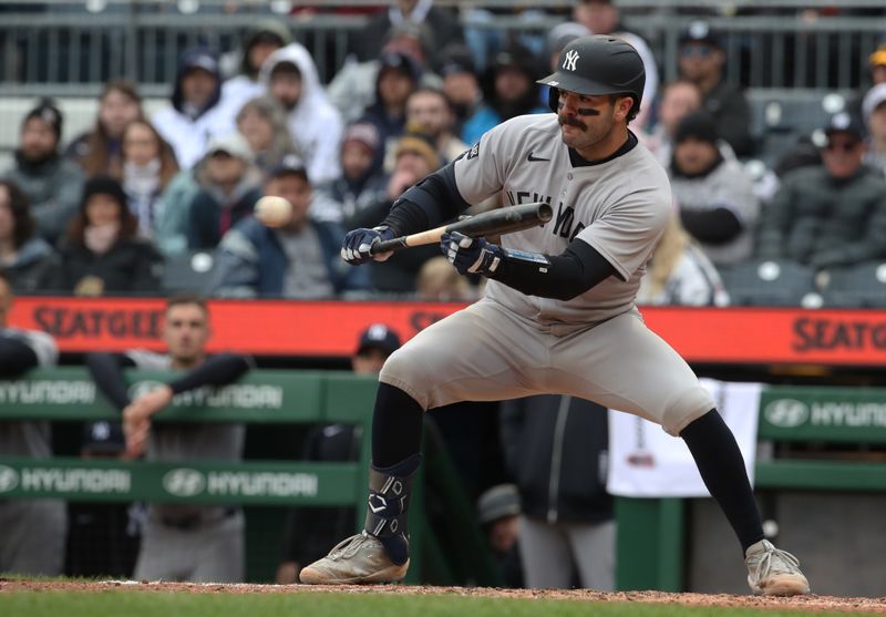 Apr 6, 2025; Pittsburgh, Pennsylvania, USA;  New York Yankees catcher Austin Wells (28) hits a sacrifice bunt against the Pittsburgh Pirates during the ninth inning at PNC Park. Mandatory Credit: Charles LeClaire-Imagn Images