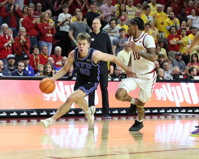 Mar 6, 2024; Ames, Iowa, USA; Iowa State Cyclones guard Keshon Gilbert (10) defends Brigham Young Cougars guard Dallin Hall (30) in the second half at James H. Hilton Coliseum. Mandatory Credit: Reese Strickland-USA TODAY Sports

