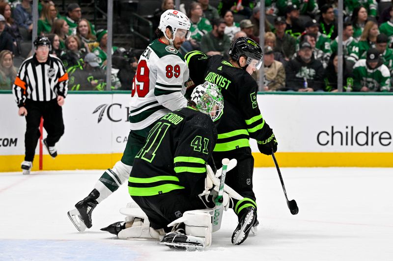 Jan 10, 2024; Dallas, Texas, USA; Dallas Stars defenseman Nils Lundkvist (5) blocks a shot in front of goaltender Scott Wedgewood (41) and Minnesota Wild center Frederick Gaudreau (89) during the third period at the American Airlines Center. Mandatory Credit: Jerome Miron-USA TODAY Sports