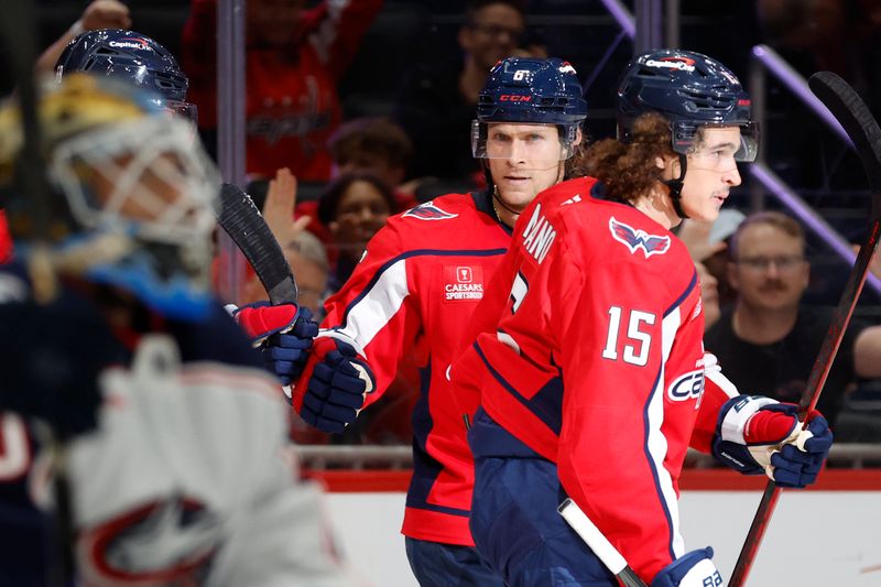 Sep 27, 2024; Washington, District of Columbia, USA; Washington Capitals defenseman Jakob Chychrun (6) celebrates with teammates after scoring a goal against the Columbus Blue Jackets in the third period at Capital One Arena. Mandatory Credit: Geoff Burke-Imagn Images