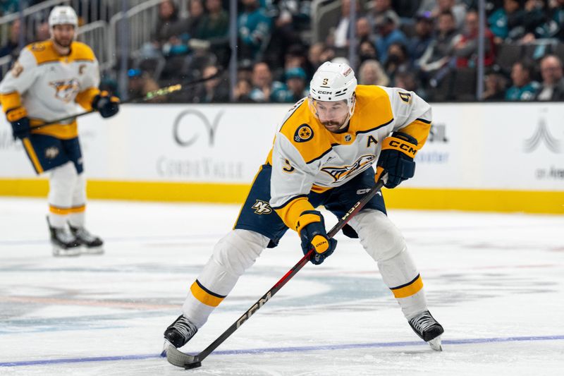 Jan 23, 2025; San Jose, California, USA;  Nashville Predators left wing Filip Forsberg (9) passes the puck against the San Jose Sharks during the third period at SAP Center at San Jose. Mandatory Credit: Neville E. Guard-Imagn Images