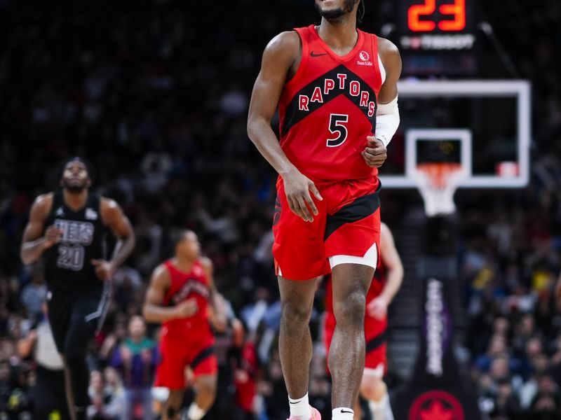 TORONTO, ON - JANUARY 1: Immanuel Quickley #5 of the Toronto Raptors celebrates against the Brooklyn Nets during the second half of their basketball game at the Scotiabank Arena on January 1, 2025 in Toronto, Ontario, Canada. NOTE TO USER: User expressly acknowledges and agrees that, by downloading and/or using this Photograph, user is consenting to the terms and conditions of the Getty Images License Agreement. (Photo by Mark Blinch/Getty Images)