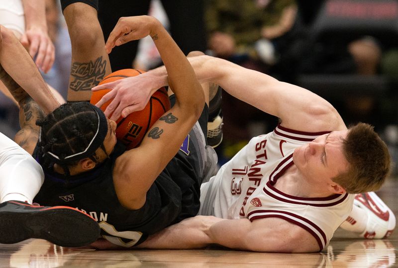 Feb 26, 2023; Stanford, California, USA; Washington Huskies guard Koren Johnson (0) and Stanford Cardinal guard Michael Jones (13) wrestle for a loose ball during the first half at Maples Pavilion. Mandatory Credit: D. Ross Cameron-USA TODAY Sports