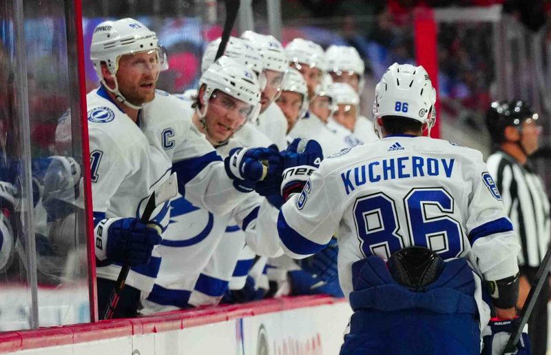 Nov 24, 2023; Raleigh, North Carolina, USA; Tampa Bay Lightning right wing Nikita Kucherov (86) celebrates his goal against the Carolina Hurricanes during the second period at PNC Arena. Mandatory Credit: James Guillory-USA TODAY Sports