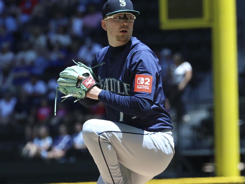 May 4, 2025; Arlington, Texas, USA;  Seattle Mariners starting pitcher Logan Evans (73) throws during the first inning against the Texas Rangers at Globe Life Field. Mandatory Credit: Kevin Jairaj-Imagn Images