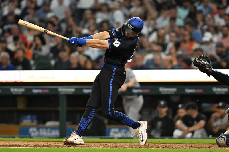 Aug 16, 2024; Detroit, Michigan, USA;  Detroit Tigers shortstop Trey Sweeney (27) hits a single against the New York Yankees in the sixth inning in his Major League debut at Comerica Park. Mandatory Credit: Lon Horwedel-USA TODAY Sports