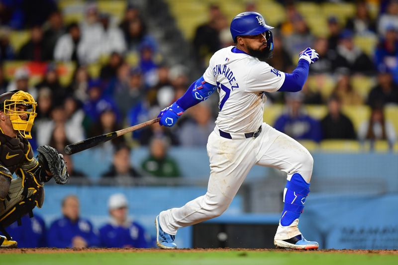 Apr 13, 2024; Los Angeles, California, USA; Los Angeles Dodgers right fielder Teoscar Hernandez (37) hits a single against the San Diego Padres during the seventh inning at Dodger Stadium. Mandatory Credit: Gary A. Vasquez-USA TODAY Sports