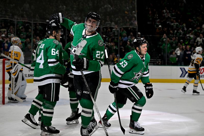 Apr 5, 2025; Dallas, Texas, USA; Dallas Stars right wing Evgenii Dadonov (63) and left wing Mason Marchment (27) and center Mikael Granlund (64) celebrate after Dadonov scores a power play goal against Pittsburgh Penguins goaltender Tristan Jarry (35) during the second period at the American Airlines Center. Mandatory Credit: Jerome Miron-Imagn Images
