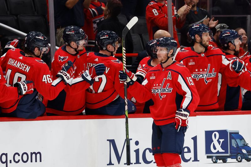 Sep 28, 2023; Washington, District of Columbia, USA; Washington Capitals center Nicklas Backstrom (19) celebrates with teammates after scoring a goal against the Detroit Red Wings in the second period at Capital One Arena. Mandatory Credit: Geoff Burke-USA TODAY Sports