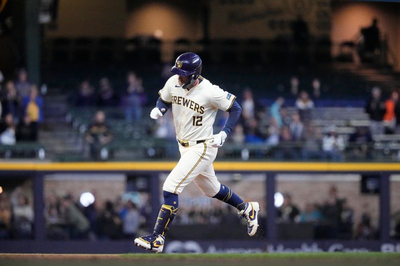 May 9, 2024; Milwaukee, Wisconsin, USA;  Milwaukee Brewers first baseman Rhys Hoskins (12) rounds the bases after hitting a home run during the first inning against the St. Louis Cardinals at American Family Field. Mandatory Credit: Jeff Hanisch-USA TODAY Sports