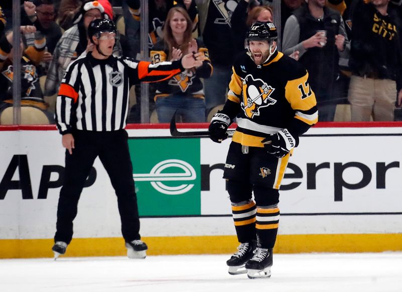 Feb 25, 2024; Pittsburgh, Pennsylvania, USA;  Pittsburgh Penguins right wing Bryan Rust (17) reacts after scoring a goal against the Philadelphia Flyers during the first period at PPG Paints Arena. Mandatory Credit: Charles LeClaire-USA TODAY Sports