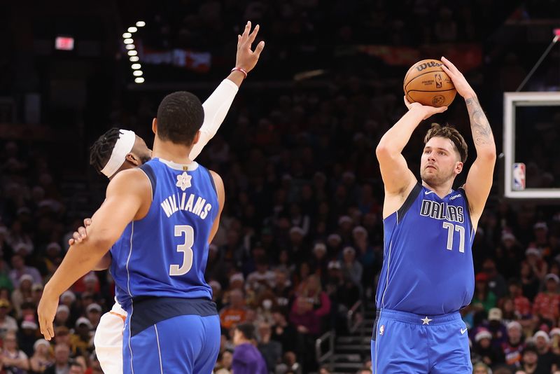 PHOENIX, ARIZONA - DECEMBER 25: Luka Doncic #77 of the Dallas Mavericks puts up a three-point shot against the Phoenix Suns during the first half of the NBA game at Footprint Center on December 25, 2023 in Phoenix, Arizona. With this basket, Doncic surpassed 10,000 career points.  The Mavericks defeated the Suns 128-114. NOTE TO USER: User expressly acknowledges and agrees that, by downloading and or using this photograph, User is consenting to the terms and conditions of the Getty Images License Agreement.  (Photo by Christian Petersen/Getty Images)