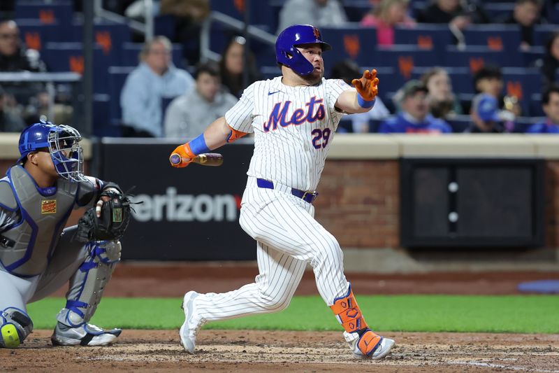Apr 12, 2024; New York City, New York, USA; New York Mets designated hitter DJ Stewart (29) follows through on an RBI single against the Kansas City Royals during the fourth inning at Citi Field. Mandatory Credit: Brad Penner-USA TODAY Sports