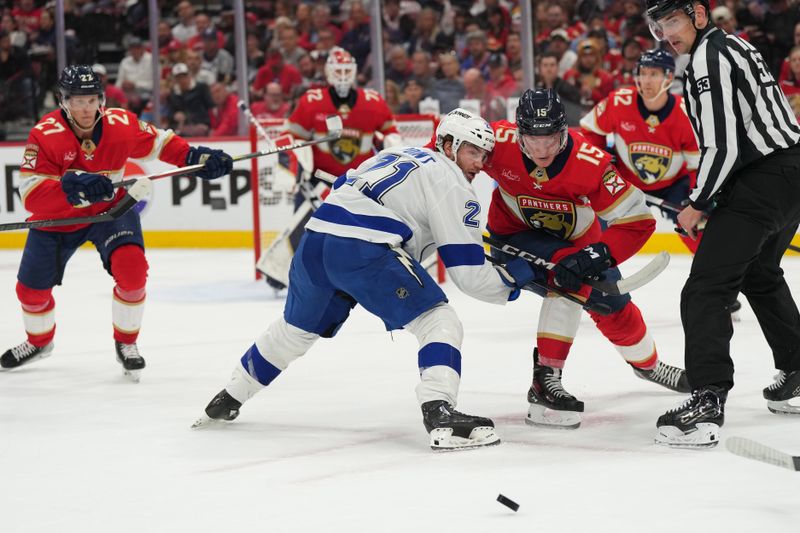 Apr 29, 2024; Sunrise, Florida, USA; Florida Panthers center Anton Lundell (15) and Tampa Bay Lightning center Brayden Point (21) face-off during the first period in game five of the first round of the 2024 Stanley Cup Playoffs at Amerant Bank Arena. Mandatory Credit: Jim Rassol-USA TODAY Sports