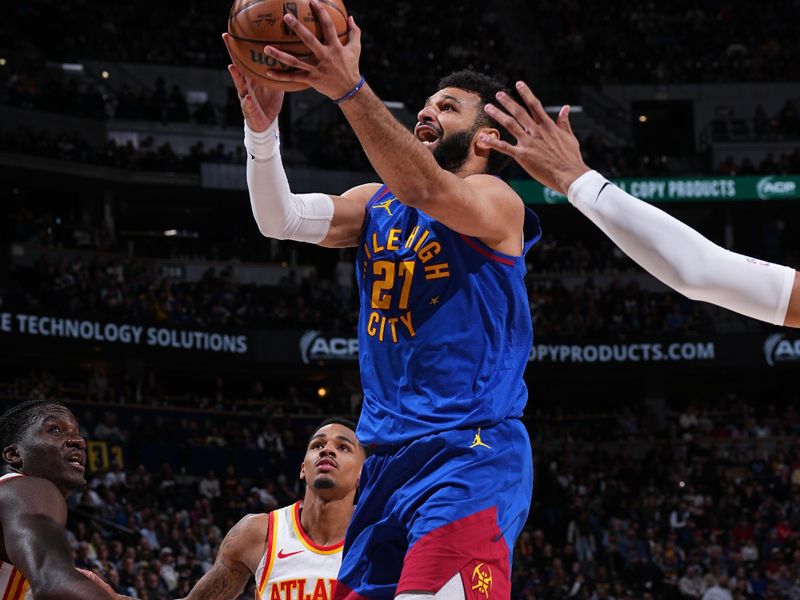 DENVER, CO - APRIL 6: Jamal Murray #27 of the Denver Nuggets drives to the basket during the game against the Atlanta Hawks on April 6, 2024 at the Ball Arena in Denver, Colorado. NOTE TO USER: User expressly acknowledges and agrees that, by downloading and/or using this Photograph, user is consenting to the terms and conditions of the Getty Images License Agreement. Mandatory Copyright Notice: Copyright 2024 NBAE (Photo by Garrett Ellwood/NBAE via Getty Images)