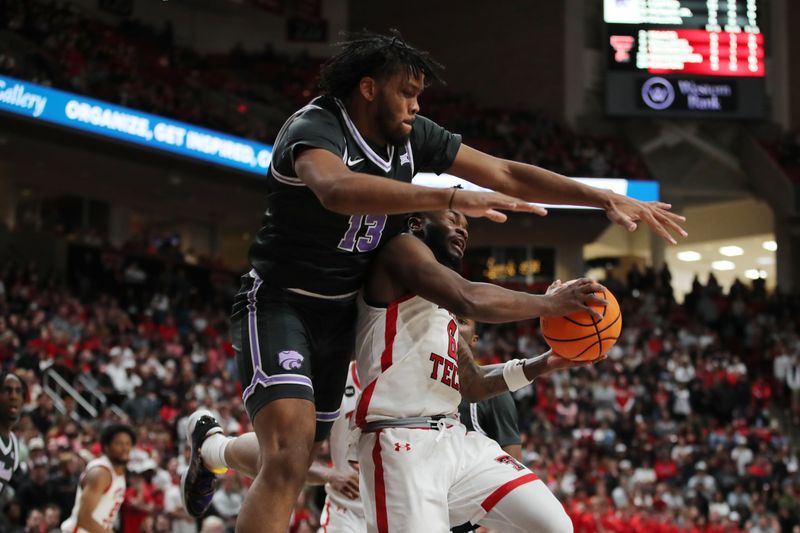 Jan 13, 2024; Lubbock, Texas, USA;  Kansas State Wildcats center Will McNair Jr. (13) goes over Texas Tech Red Raiders guard Joe Toussaint (6) in the second half at United Supermarkets Arena. Mandatory Credit: Michael C. Johnson-USA TODAY Sports