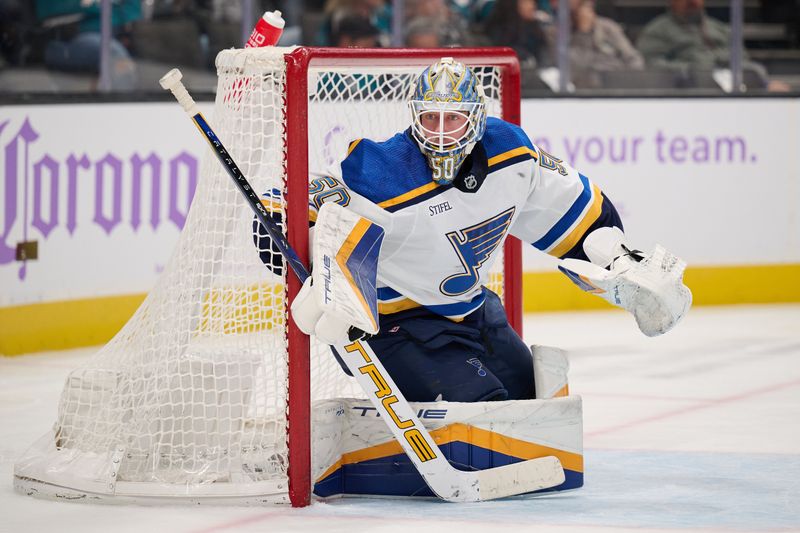 Nov 16, 2023; San Jose, California, USA; St. Louis Blues goaltender Jordan Binnington (50) tends net against the San Jose Sharks after entering the game in the second period at SAP Center at San Jose. Mandatory Credit: Robert Edwards-USA TODAY Sports